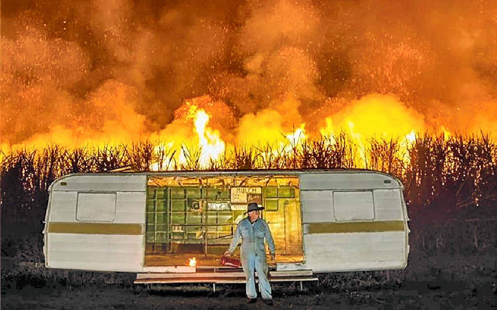 FIELD OF FIRE: Adam Hourigan’s photograph of Eric Lyons and the iconic caravan on the Yamba Rd at Palmers Island was part of his portfolio that won the Nikon-Walkley Award. FIELD OF FIRE: Adam Hourigan’s photograph of Eric Lyons and the iconic caravan on the Yamba Rd at Palmers Island was part of his portfolio that won the Nikon-Walkley Award.